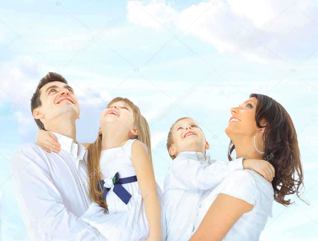 portrait of a cute family on a sky background