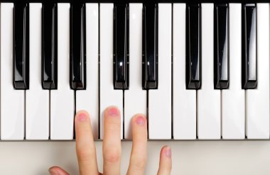 Child Playing the Piano clipart