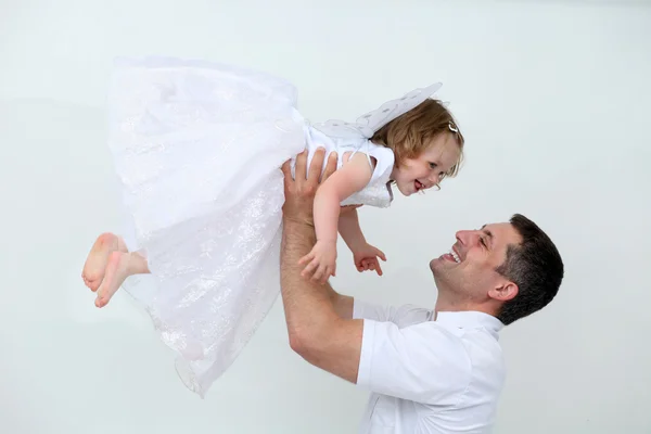 Father holding his hands on the little girl — Stock Photo, Image