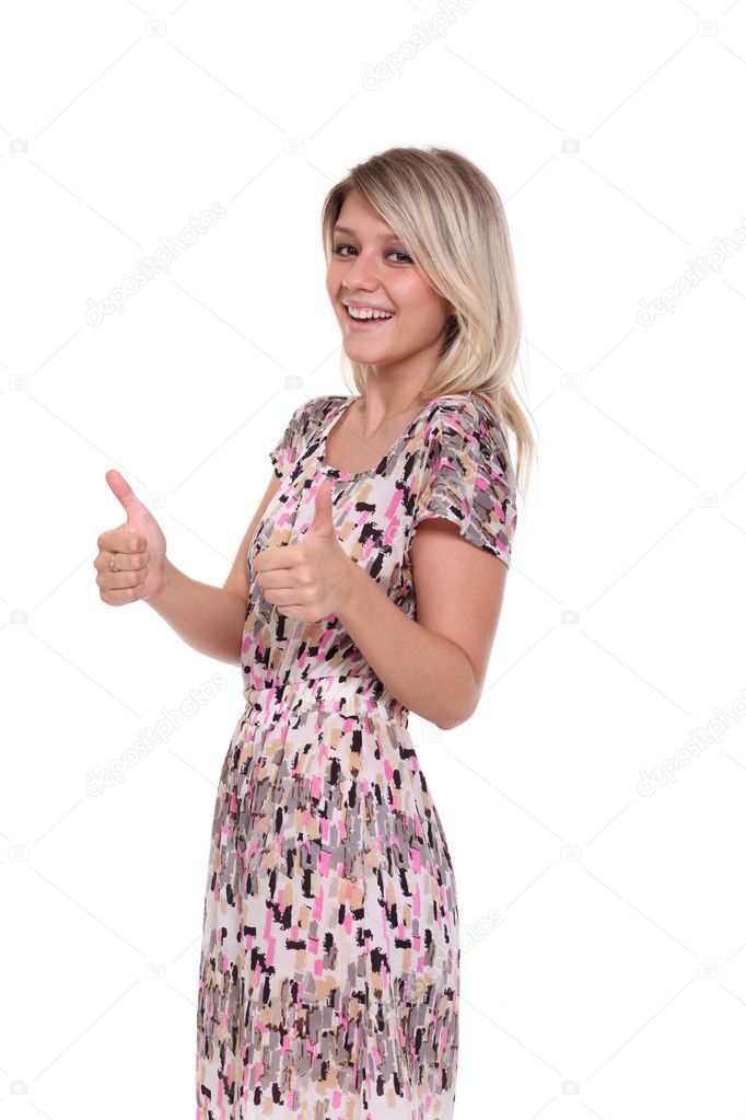 Woman dressed in red is showing thumb up gesture using both hands