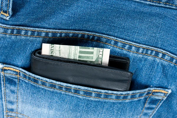 Гаманець гроші кишенькові джинси — стокове фото