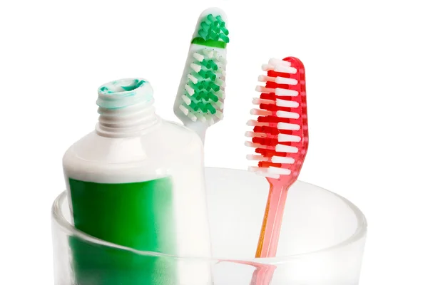 Vetro e due spazzolini da denti — Foto Stock