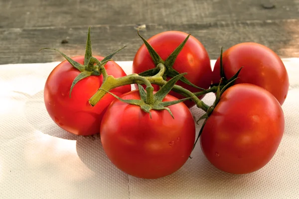 Tomatoes on table — Stock Photo, Image