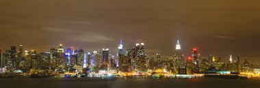 New York City Manhattan skyline panorama at night over Hudson Ri clipart