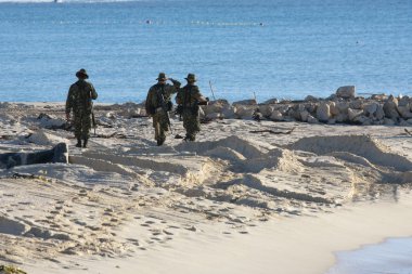 MEXICO - FEBRUARY 7: Soldiers on duty checking the boarder on Fe clipart