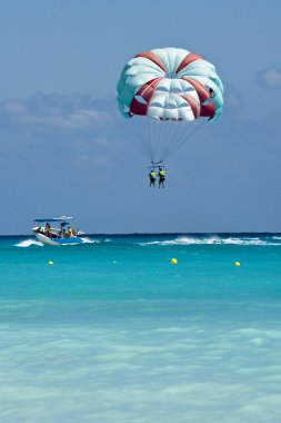 Couple flys on a parachute clipart