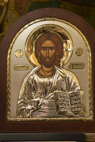 Golden Icon of Jesus Christ in brown frame — Stock Photo, Image