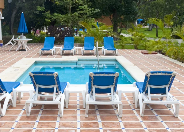 stock image Beautiful pool and patio in tropical setting