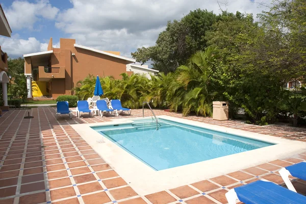 stock image Beautiful pool and patio in tropical setting