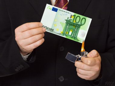 Hands and burnning money clipart