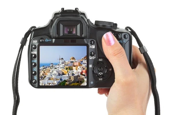 Câmera na mão e vista de Santorini (Grécia) — Fotografia de Stock