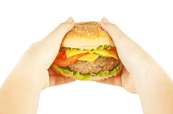 Hamburger in handen — Stockfoto
