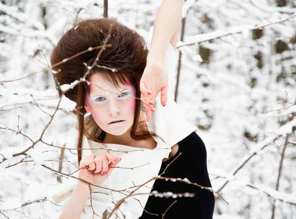 Fashion portrait of a model with make-up in forest — Stock Photo, Image