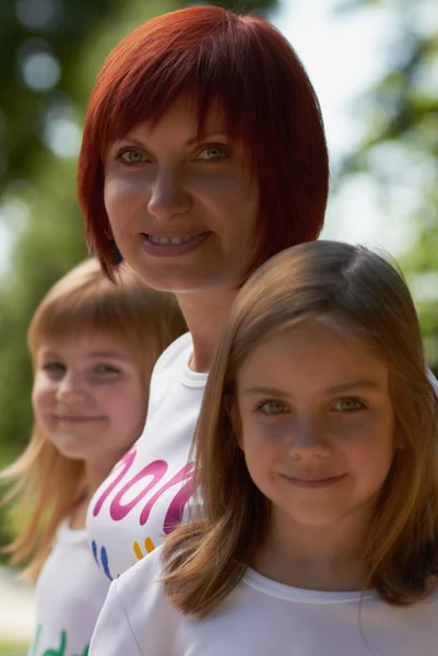 stock image Happy mother and her cute daughters outdoors