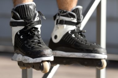 Skater in aggressive rollerblades in a skatepark clipart