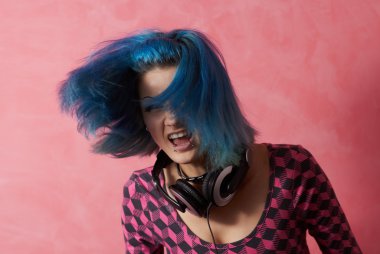 Punk girl DJ with dyed turqouise hair clipart