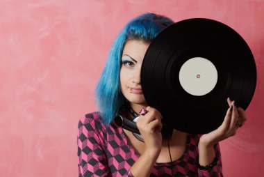 Punk girl DJ with dyed turqouise hair clipart