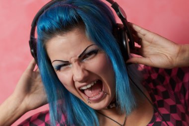Punk girl DJ with dyed turqouise hair clipart