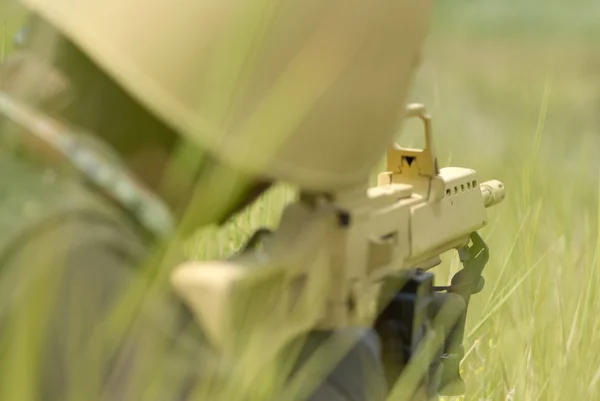 Soldier in yellow camo targeting — Stock Photo, Image