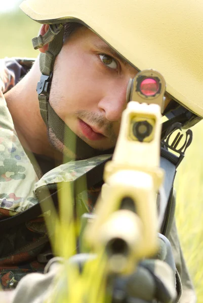 Portrait of soldier in helmet targeting — Stock Photo, Image