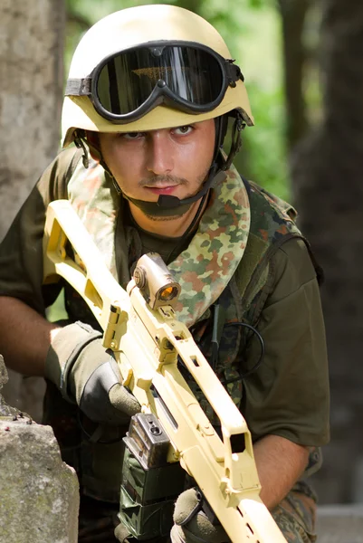 Soldier with a rifle moving out — Stock Photo, Image