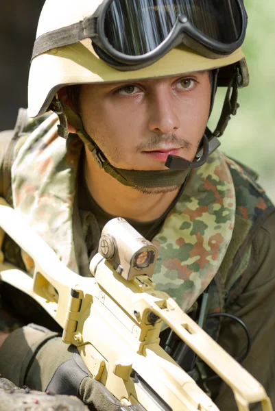 Portrait of a soldier in helmet with headset — Stock Photo, Image