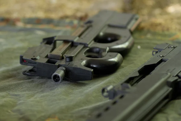 stock image Automatic rifle lying on the ground