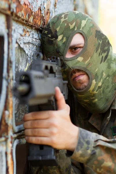 Portrait of terrorist with a gun — Stock Photo, Image