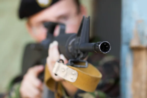 Barrel of a gun aiming the target — Stock Photo, Image