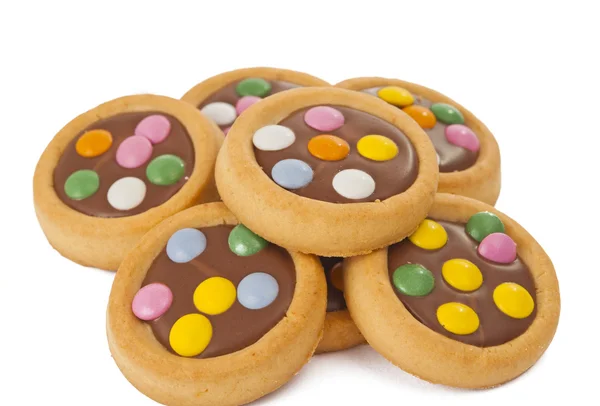 Biscotti con cioccolato al latte e fagioli colorati isolat — Foto Stock