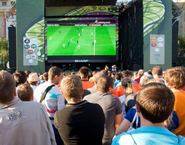 Supporters watching the match Poland - Greece in Kharkov, Ukrain clipart