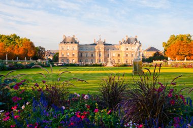 Jardin du Luxembourg with the Palace and statue. Few flowers are clipart