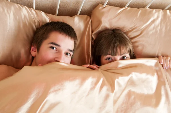 Young couple in a bed Stock Photo