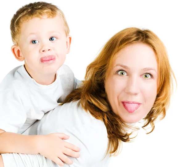 Mujer e hijo sacando lenguas — Foto de Stock