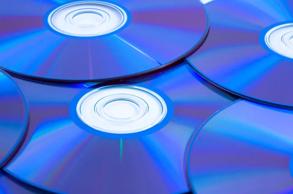 Sfondo di alcuni compact disc variopinti — Foto Stock