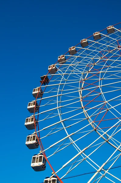 stock image Ferris wheel on blue background