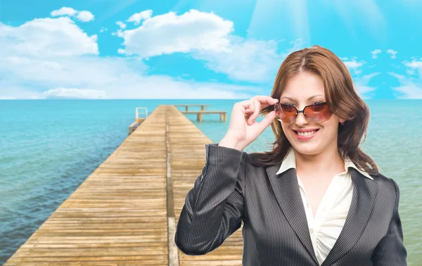 Business woman on background of pier — Stock Photo, Image