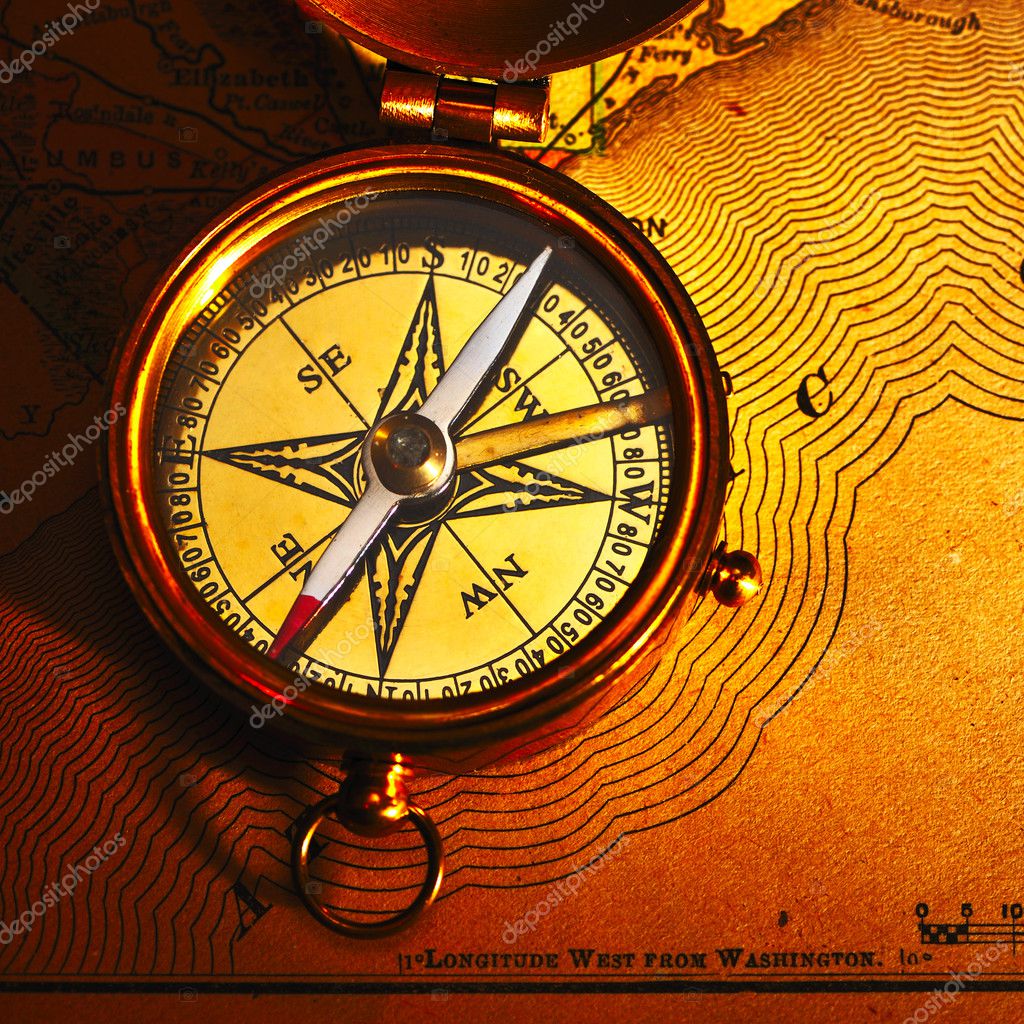 Antique brass compass over old background Stock Photo by ©haveseen 11171952