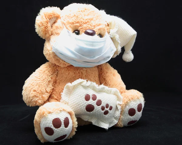 Teddy in mask — Stock Photo, Image