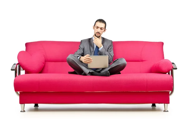 Hombre sentado en el sofá — Foto de Stock