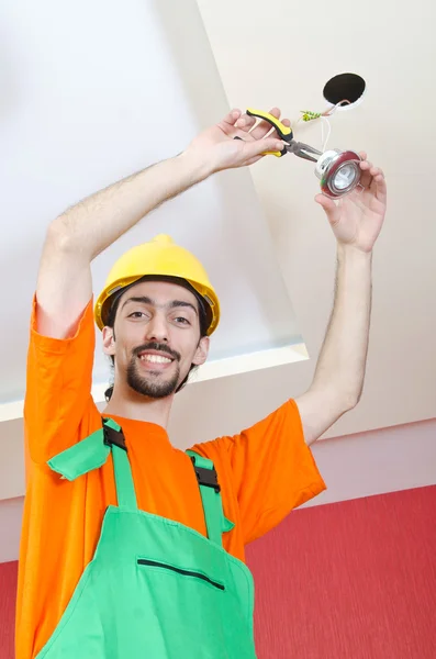 Electrician working on cabling lighting — Stock Photo, Image