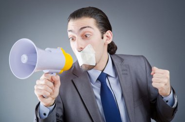 Businessman shouting via loudspeaker clipart