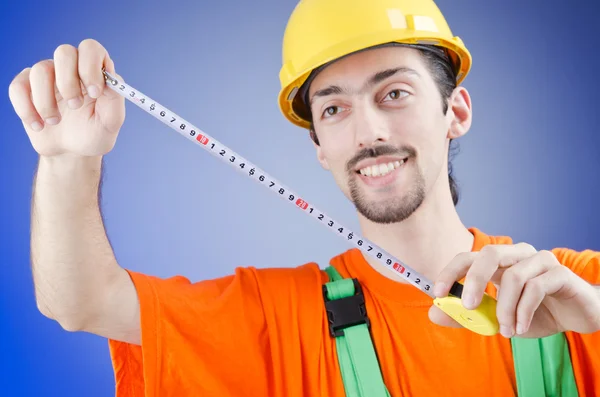 Repairman with measuring tape — Stock Photo, Image