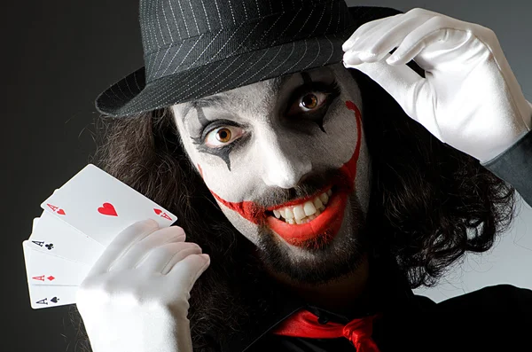 Joker with cards in studio shoot — Stock Photo, Image