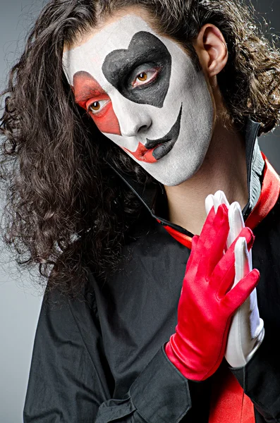 Coringa com máscara facial em estúdio — Fotografia de Stock