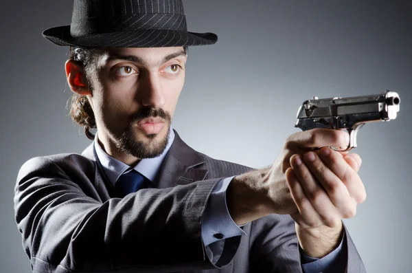 Businessman man with hand gun — Stock Photo, Image