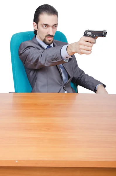 Homme d'affaires avec pistolet sur blanc — Photo