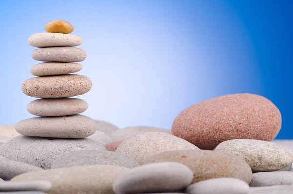 Pebbles stack against gradient background — Stock Photo, Image