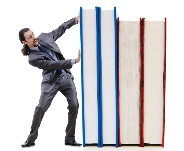 Affärsman med böcker på vit — Stockfoto