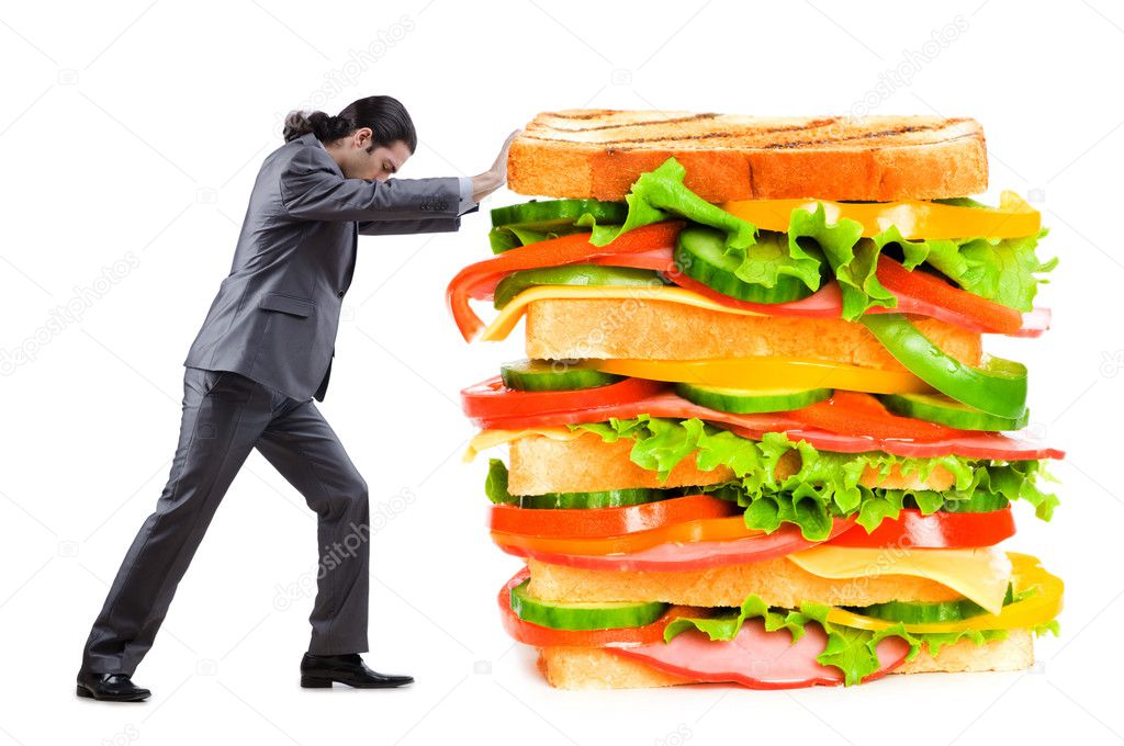 Man and giant sandwich on white